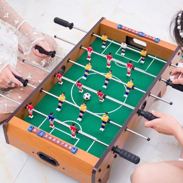 Tabletop soccer game included with one football table, 6 pcs handles with 18 players and 2 pcs balls. You can get this product in Erjee Camping Store, camping gear in Bali.